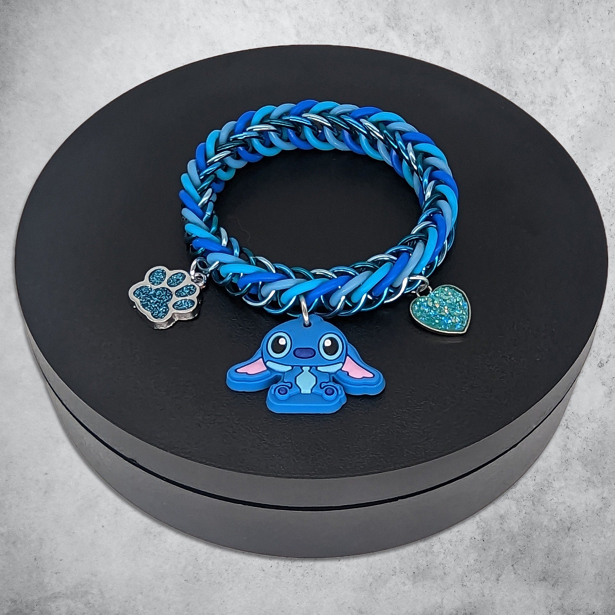 Blue Alien Charm Bracelet Place in Black Revolving Stand